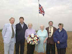 An unforgettable moment for Winifred and Bunty when they visit the crash site where Sgt Carmichael went down.  They are pictured with Mervyn Young, a fellow Spitfire pilot from 129 Squadron, Wim Hueghe, from the Crash Site Recovery Team, Aviation Historian Dirk Decuypre and Maria Van Eecke, who as a 7 year old witnessed the crash