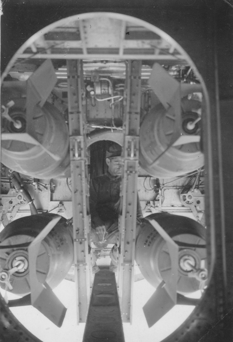 P.S. Blanks loading and arming bombs in bomb bay of Martin B-26 Marauder