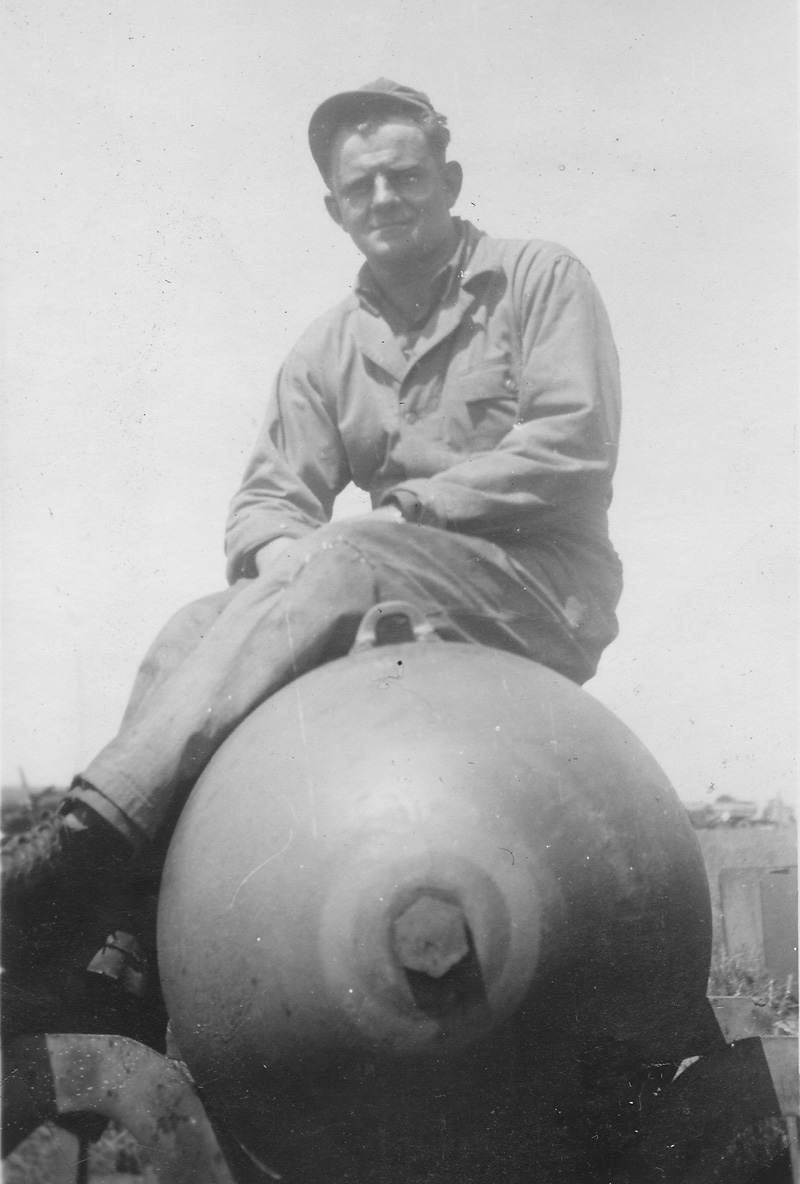 A second American B26 Marauder crewman sitting on 2000 pound bomb.