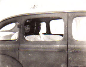 Dwight D. Eisenhower in car touring base.