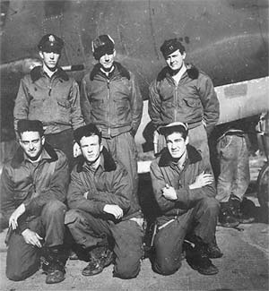 1st Lt. Robert J. Buss, 2nd Lt. Larue C. Bentz, Capt. Robert Brockhouse; kneeling: T/Sgt. Julius M. Bargholz, S/Sgt. James Barr, S/Sgt. W.H. Callon 